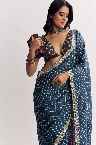 Teal blue manipuri zigzag pattern leheriya printed saree with embroidery work lace