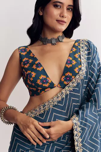 Teal blue manipuri zigzag pattern leheriya printed saree with embroidery work lace