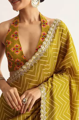 Mehendi green manipuri zigzag pattern leheriya printed saree with embroidery work lace