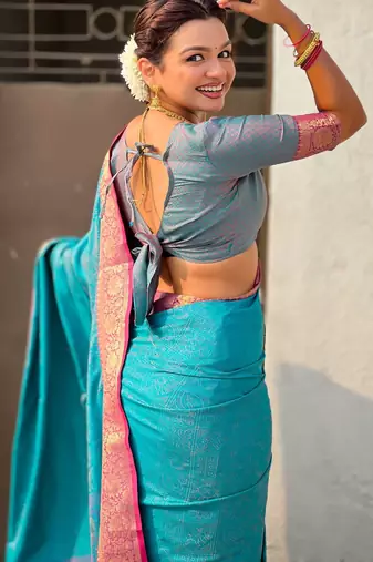 Teal contrast woven zari floral border & pallu work  silk blend  