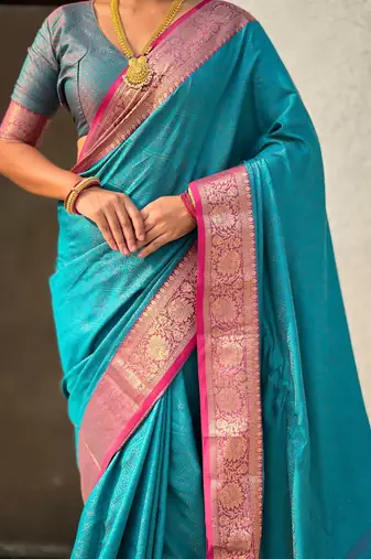 Teal contrast woven zari floral border & pallu work  silk blend  
