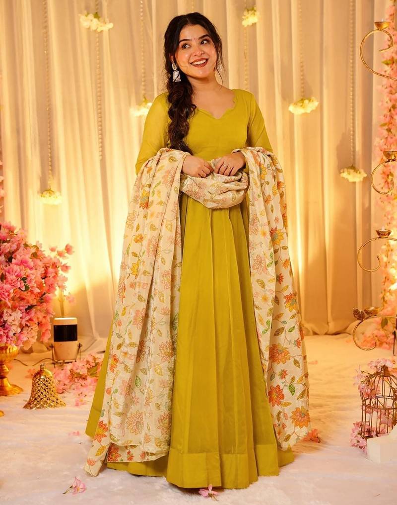 Mustard color sophisticated soft silk gown with stylish dupatta