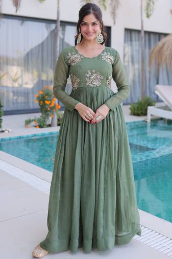Green color beautiful ceremonial gown for ethnic stylish looks