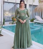 Green color beautiful ceremonial gown for ethnic stylish looks