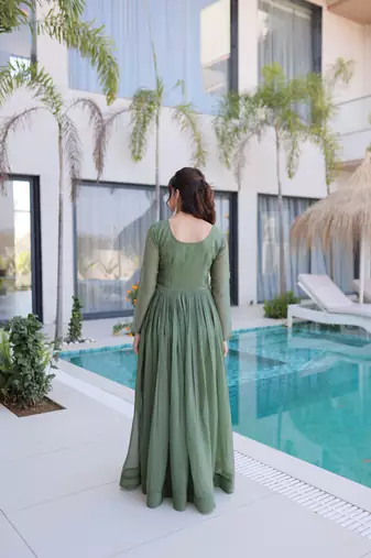 Green color beautiful ceremonial gown for ethnic stylish looks
