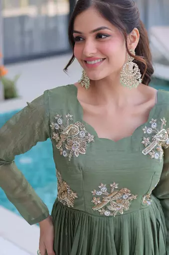 Green color beautiful ceremonial gown for ethnic stylish looks