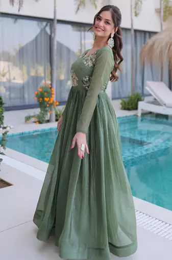 Green color beautiful ceremonial gown for ethnic stylish looks