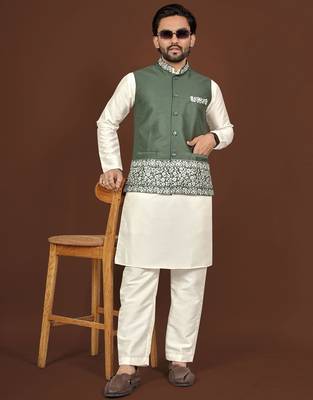 white silk kurta pyjama set with olive green embroidered nehru jacket
 1
