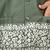 white silk kurta pyjama set with olive green embroidered nehru jacket