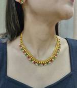 gold polki necklace set with multicolor stone detail