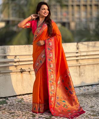 Orange sophisitcated paithani silk blend saree with meenakari woven  4