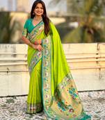Parrot green color sophisitcated paithani silk saree with meenakari woven designer