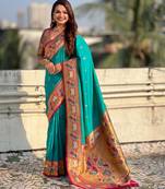 Sea green color sophisitcated paithani silk saree with meenakari woven designer
