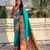 Sea green color sophisitcated paithani silk saree with meenakari woven designer
