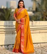 Mustard color graceful soft silk fabric woven designer saree