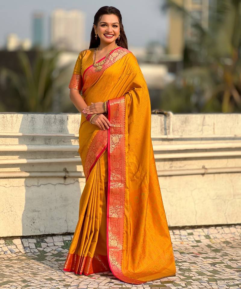 Mustard color graceful soft silk fabric woven designer saree