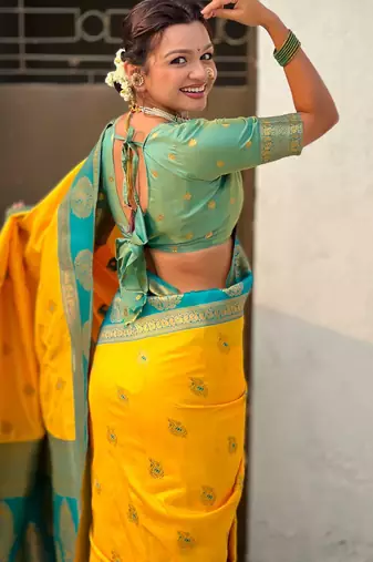 Yellow woven zari traditional motifs work silk blend   