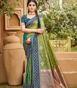 Green color soft silk fabric woven designer ethnic ceremonial saree