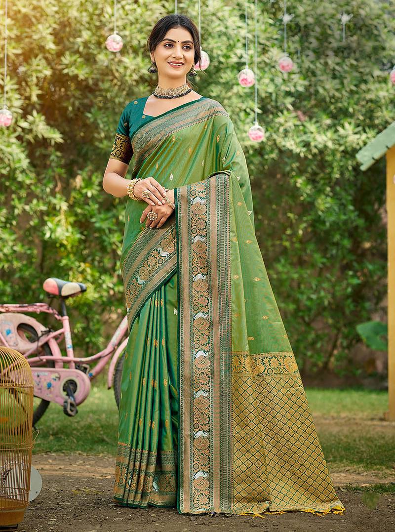 Green color woven designer soft silk fabric trendy rich looks saree