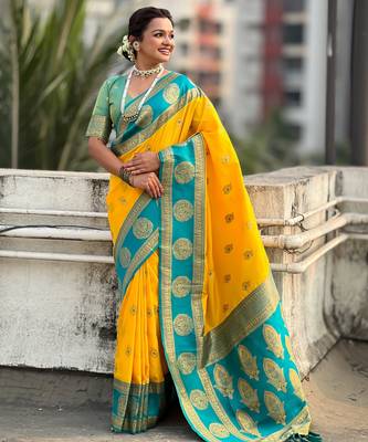 Yellow soft silk blend woven girlie rich look saree 4
