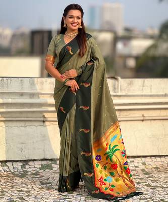 Green soft silk blend woven deisgner partywear saree 1