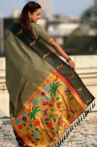 Green color soft silk woven deisgner partywear saree