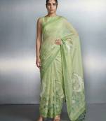 Light green woven floral & peacock motifs work silk blend fabric traditional elegant style
