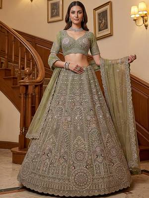 Ravishing Green Heavy Embroidered Net Evening Wear Lehenga Choli 1
