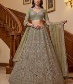 Ravishing Green Heavy Embroidered Net Evening Wear Lehenga Choli