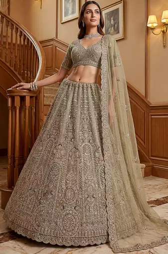 Ravishing Green Heavy Embroidered Net Evening Wear Lehenga Choli
