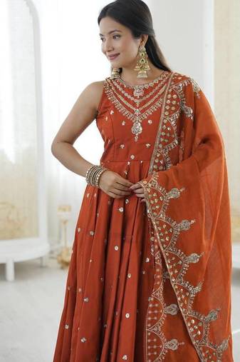 Orange color roman silk embroidery work  party wear gown