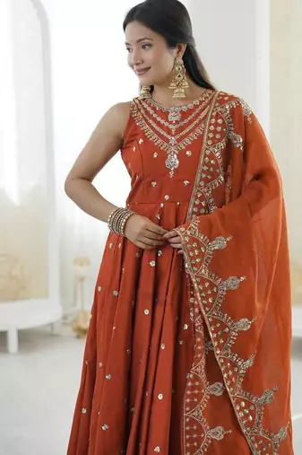 Orange color roman silk embroidery work  party wear gown