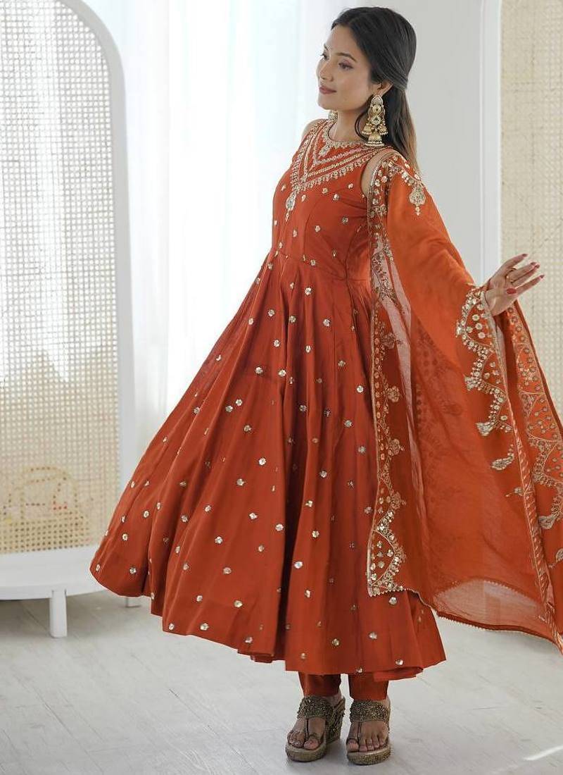 Orange color roman silk embroidery work  party wear gown
