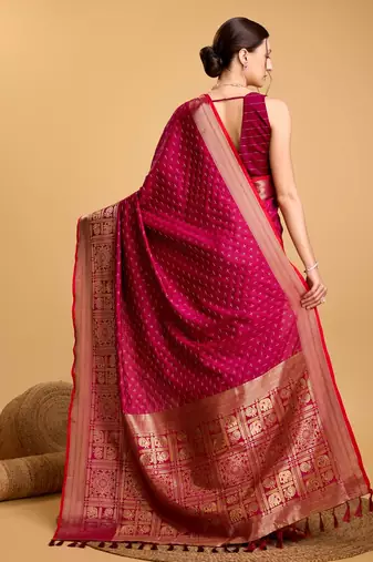 Dark pink woven embellished self design pure silk banarasi saree with blouse