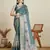 Teal green printed floral print woven cotton silk kalamkari saree with blouse