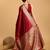 Red woven self design embellished pure silk kanjivaram saree with blouse