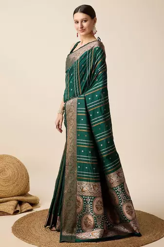 Green woven embellished self design pure silk kanjivaram saree with blouse