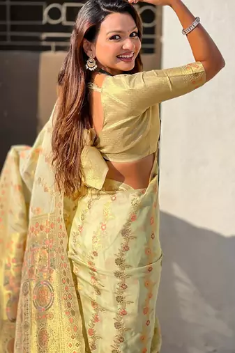 Light gold woven zari floral & traditional motifs work silk blend fabric  traditional festive style