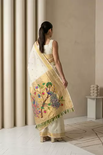 Off white woven zari buti & peacock pallu work silk blend fabric traditional festive style paithani style saree