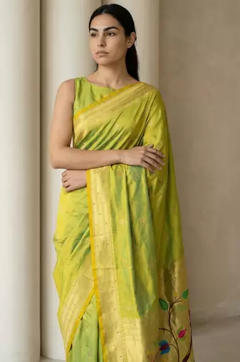 Light lime woven zari buti & peacock pallu work silk blend fabric traditional festive style paithani style saree