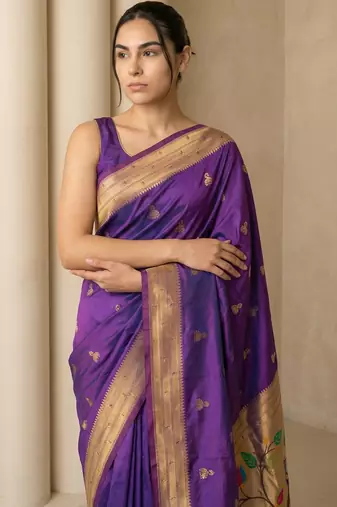 Purple woven zari buti & peacock pallu work silk blend fabric traditional festive style paithani style saree