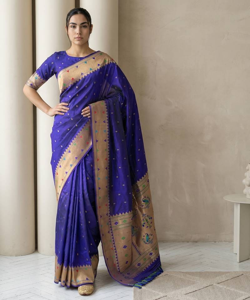 Blue with gold bblder contrast traditional peacock & triangle motifs work silk blend fabric rich ethnic festive wear