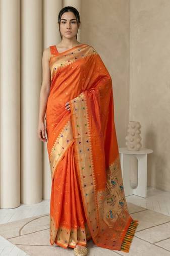 Orange with gold border contrast traditional peacock & triangle motifs work silk blend fabric rich ethnic festive wear