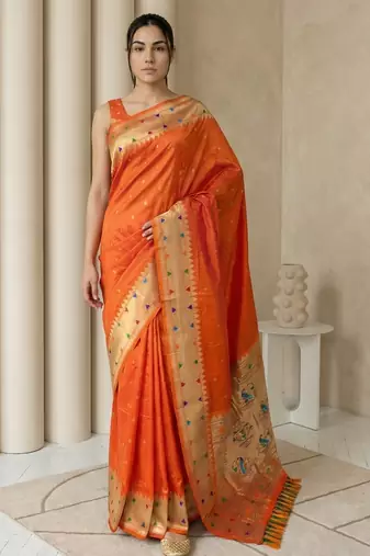 Orange with gold border contrast traditional peacock & triangle motifs work silk blend fabric rich ethnic festive wear