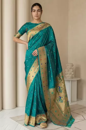 Teal with gold bteder contrast traditional peacock & triangle motifs work silk blend fabric rich ethnic festive wear