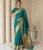Teal with gold bteder contrast traditional peacock & triangle motifs work silk blend fabric rich ethnic festive wear