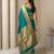 Teal with gold bteder contrast traditional peacock & triangle motifs work silk blend fabric rich ethnic festive wear