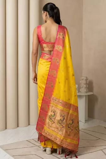 Yellow gold paisley zari motifs rich silk blend fabric elegant festive & wedding wear contrast border