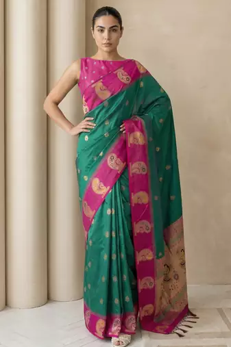 Green gold paisley zari motifs rich silk blend fabric elegant festive & wedding wear contrast border