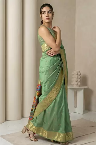Light olive pallu woven zari buti & traditional motifs work silk blend fabric traditional festive style